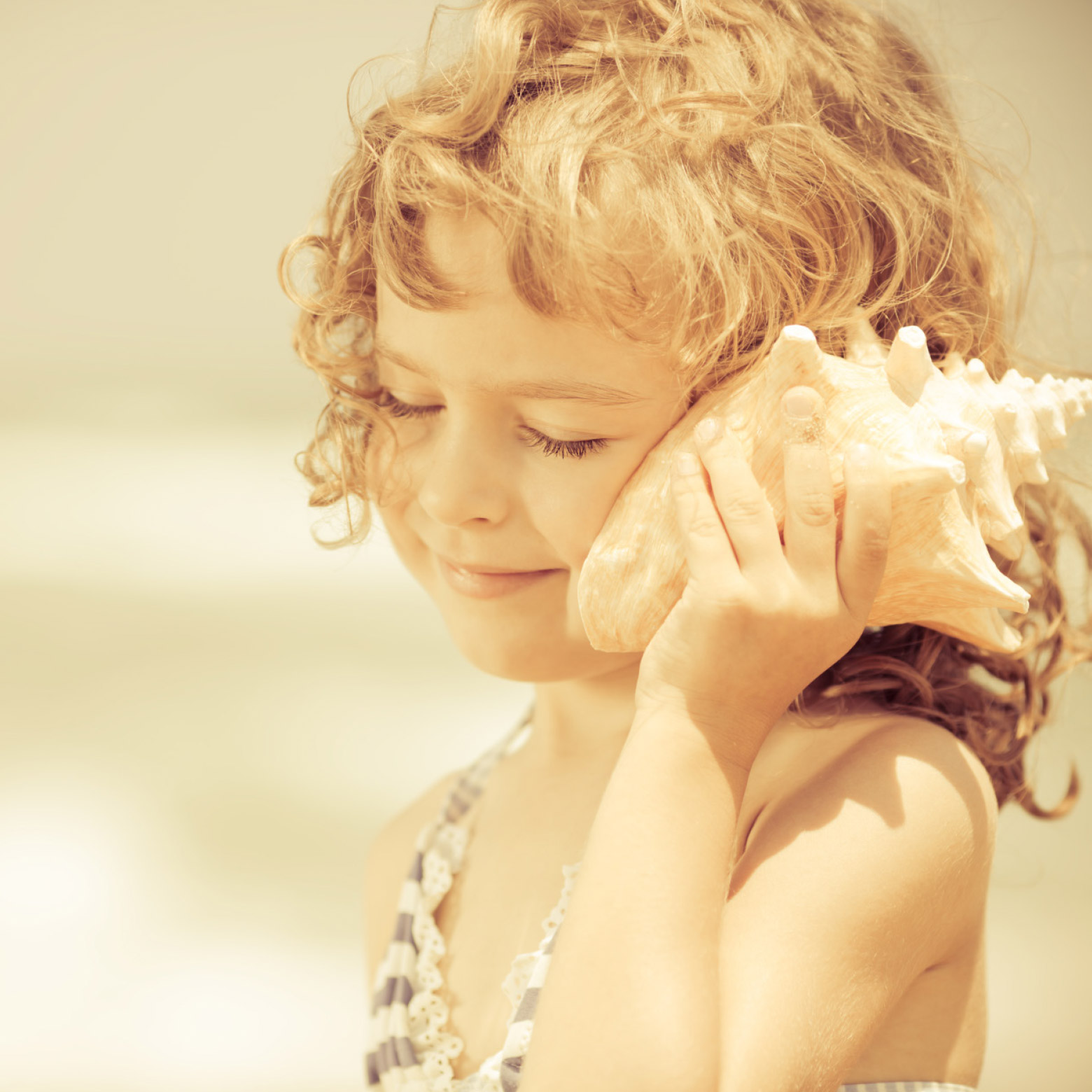 Child holding shell